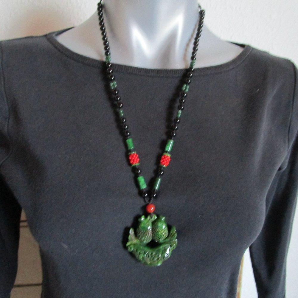 Jade pendant with beadwork, dark green from China